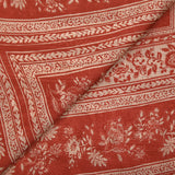 Satin crinkle muslin printed with ecru and brick floral borders
