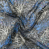 Mousseline imprimée lurex feu d'artifice bleu fond noir