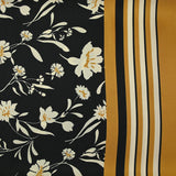 Satin polyester twill printed with ecru flowers and ocher border, black background