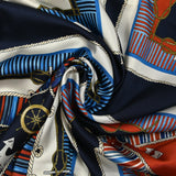 Satin polyester twill printed with red and blue marine knots on a midnight blue background