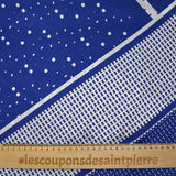 Satin crinkle muslin printed with white and royal blue graphic polka dots