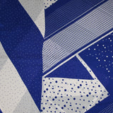Satin crinkle muslin printed with white and royal blue graphic polka dots