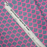 Coated poplin with green plant print, pink background