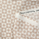 Coated poplin printed with fields of flowers, beige, white background