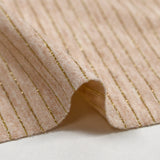 Jersey de polyviscose rayé Lurex fond pêche chiné