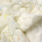 Mutelass embroidered multicolored flowers ecru background