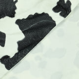 Fausse fourrure poils mi-longs vache noir