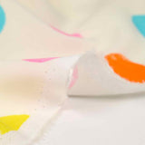 Multicolored polka dot printed viscose with ecru background