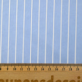 Striped woven-dyed polyviscose satin with sky blue background