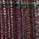 Capucine wool blend tweed green and black line wine background