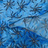 Jersey de terciopelo lurex estrella de mar fondo azul