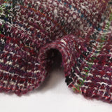 Capucine wool blend tweed green and black line wine background