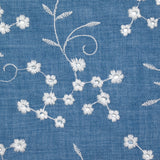 Twill de polyester brodé marguerite fond bleu