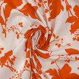 Viscose imprimée silhouettes de fleurs orange fond blanc
