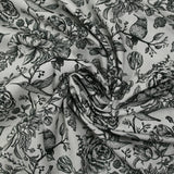 Viscose printed with roses and hummingbirds on a light gray background