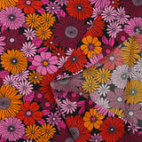 Viscose printed sixties flowers in red, plum and orchid