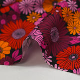 Viscose printed sixties flowers in red, plum and orchid