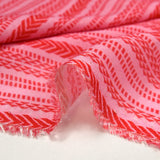 Viscose and wool veil with red Aztec print and pink background
