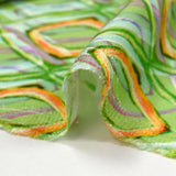 Viscose satin with retro disco green background print