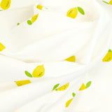 Coton imprimé citron jaune fond blanc