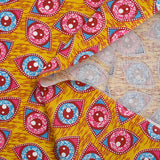 Coton imprimé ethnique Kampen fuchsia et turquoise fond jaune