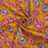Coton imprimé ethnique Kampen fuchsia et turquoise fond jaune