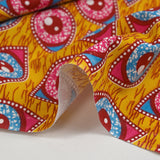Coton imprimé ethnique Kampen fuchsia et turquoise fond jaune