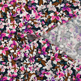 Viscose printed with purple, fuchsia and brown Ornella flowers