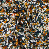 Viscosa estampada con flores de Ornella en naranja quemado, pato y azul marino