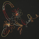 Mousseline crinkle fleurs brodées fond noir