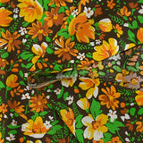 Coton imprimé vent floral orange fond marron
