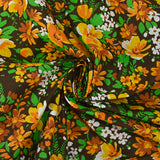 Coton imprimé vent floral orange fond marron