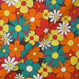 Coton imprimé floraison disco rouge, orange et turquoise