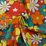 Coton imprimé floraison disco rouge, orange et turquoise