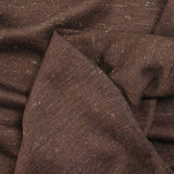 Fine iridescent golden wool knit with brown background