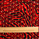Plissé polyester imprimé écorce et losange doré fond rouge