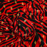 Plissé polyester imprimé écorce et losange doré fond rouge