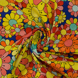 Coton imprimé flower power corail fond bleu roi