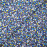 Cotton printed meadow in flowers blue indigo background