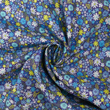 Cotton printed meadow in flowers blue indigo background