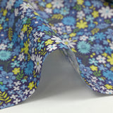 Cotton printed meadow in flowers blue indigo background