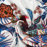 Jungle print quilted jersey with parrot on white background