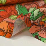 Coton imprimé constellation florale orange