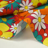 Coton imprimé floraison disco rouge, orange et turquoise