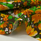 Coton imprimé vent floral orange fond marron