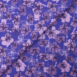 Popeline de coton imprimée silhouette en fleurs lilas fond indigo