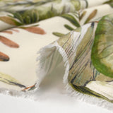 Natural printed viscose in green leaves on an ecru background