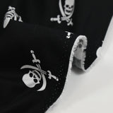 Coton imprimé les pirates de l’au-delà fond noir