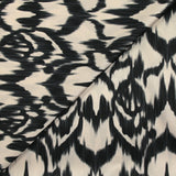 Black ikat printed polyester satin with ecru background