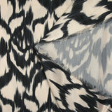 Black ikat printed polyester satin with ecru background